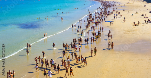 SAN SEBASTIAN, SPAIN - September 24, 2018: Aerial View Of People Crowd Relaxing On Beach In city of San Sebastian