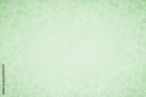 Green Christmas background with snowflakes 