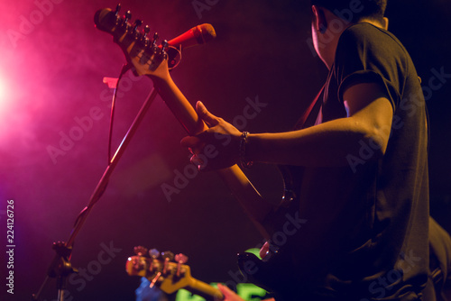 Stage Live performance.Abstract musical background. Musician Playing guitar and concert concept.Live music background.Music festival.Instrument on stage and band