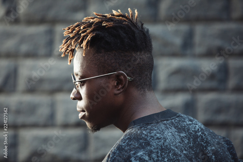 Canvas-taulu African rapper man with dreadlocks hairstyle wearing modern glasses