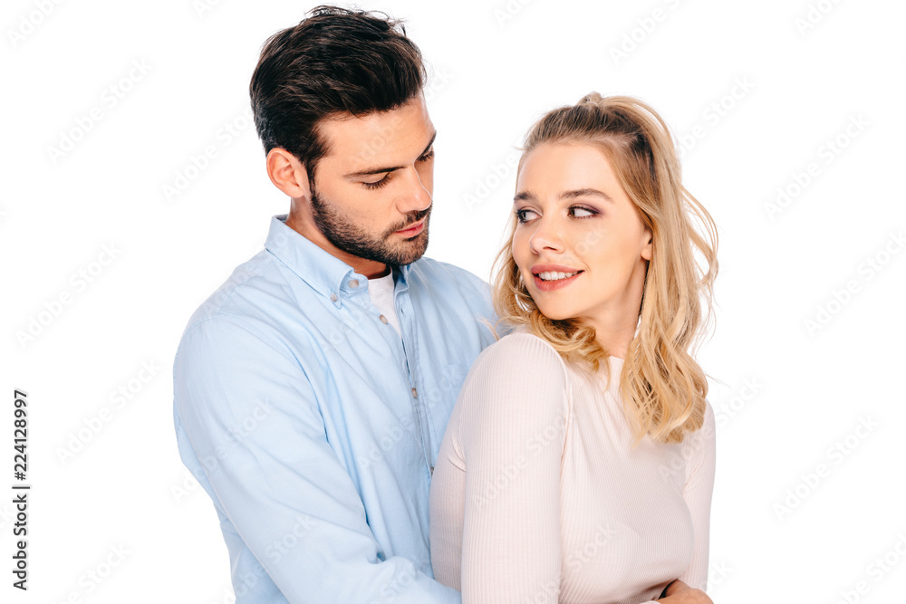 beautiful young couple embracing and smiling each other isolated on white beautiful young couple embracing and smiling each other isolated on white