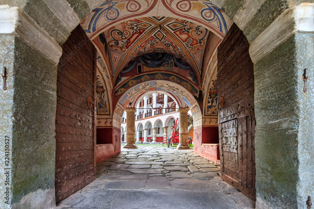 Beautiful view of the entrance gate at the Orthodox Rila Monastery, a famous tourist attraction and cultural heritage monument in the Rila Nature Park mountains in Bulgaria