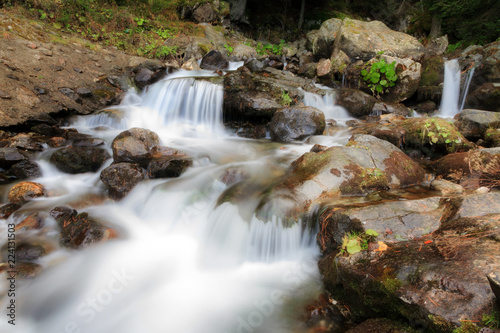 Fototapeta Naklejka Na Ścianę i Meble -  Beautiful cold cascade stream in the Rila Nature Park near the Rila lakes in Bulgaria in autumn