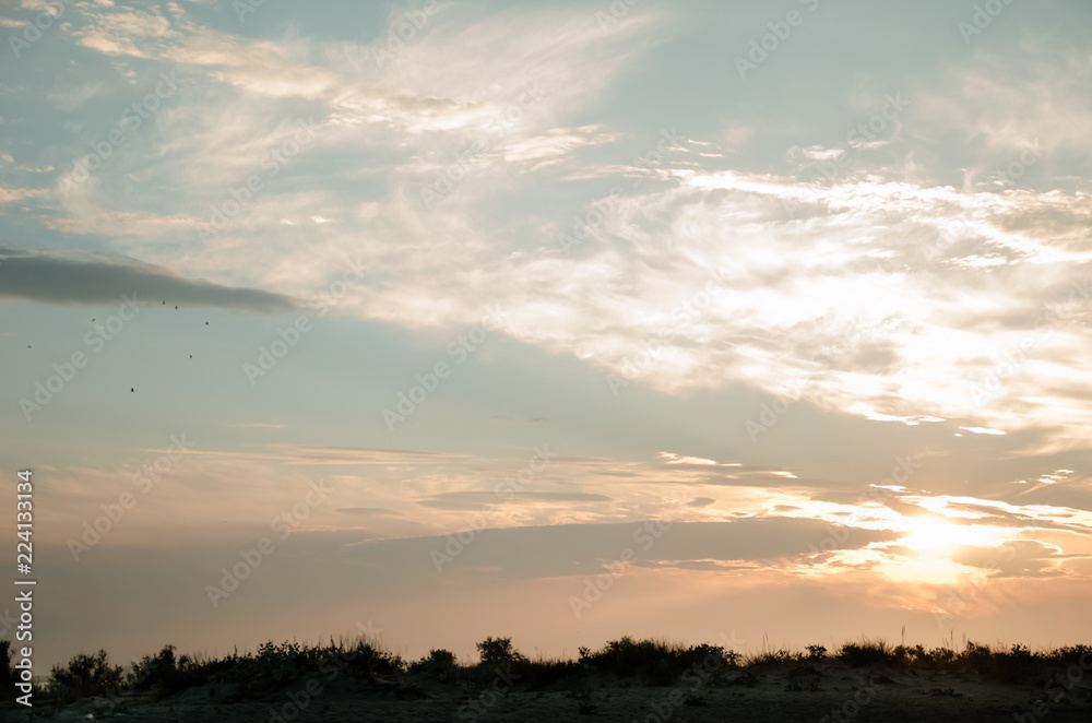 Dawn by the sandy seashore