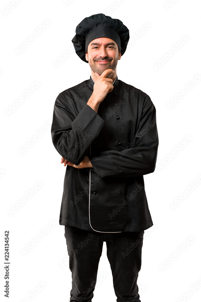 Chef man In black uniform smiling and looking to the front with confident face on isolated white background Chef man In black uniform smiling and looking to the front with confident face on isolated white background