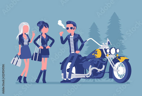 Cool rocker boy in a biker leather jacket near chopper