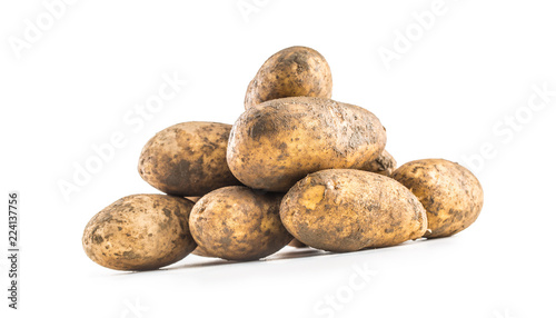 Ripe dirty potatoes isolated on white background