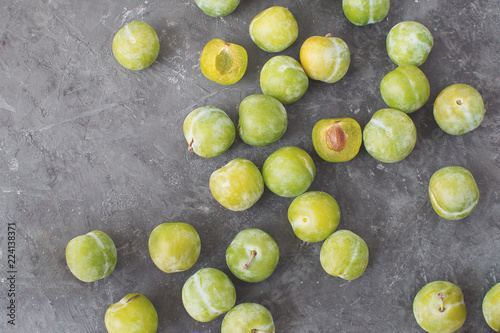 Delicious ripe green plums Greengages Black textured concrete background Autumn harvesting Flat lay Copy space