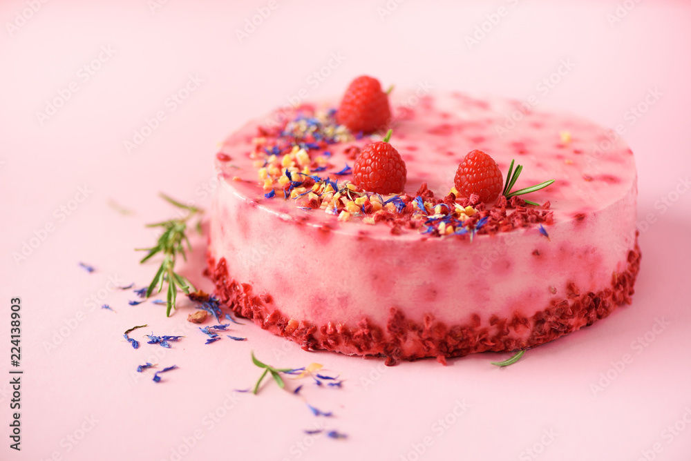 Pink marble cake with raspberries, dry flowers, rosemary. Copy space for your text. Pink marble cake with raspberries, dry flowers, rosemary. Copy space for your text.