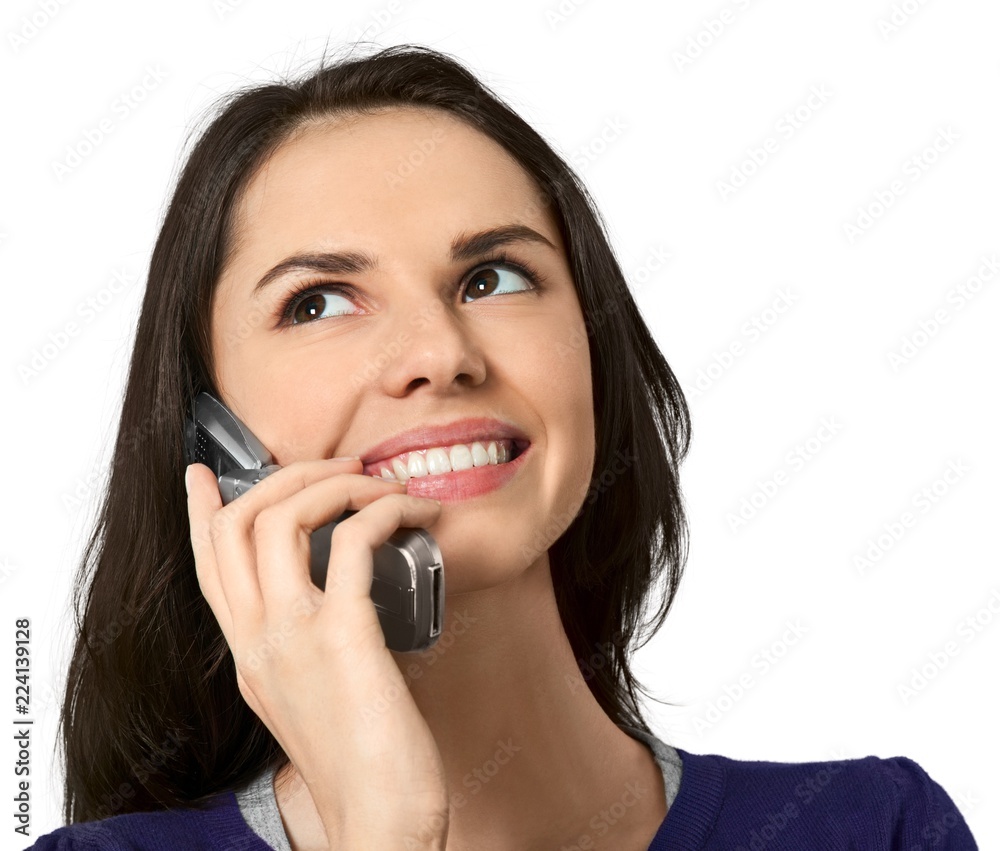 Friendly Young Woman Talking on Phone - Isolated Friendly Young Woman Talking on Phone - Isolated