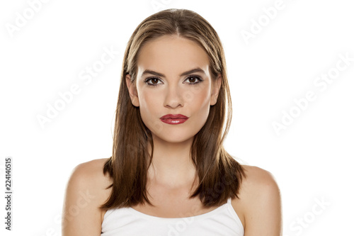 Portrait of young beautiful woman with makeup on white backgeound photo