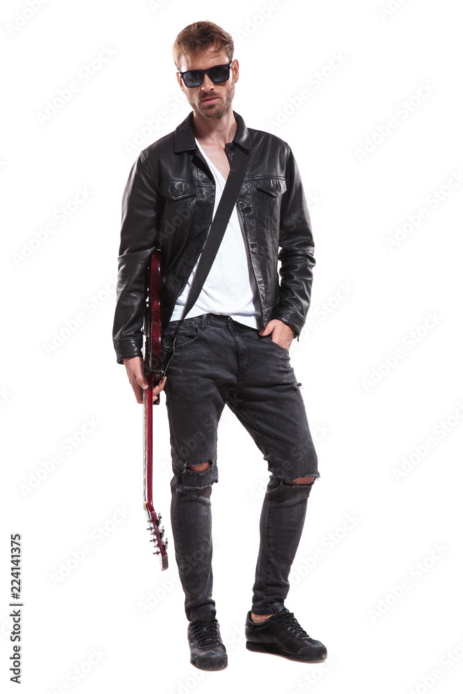 relaxed guitarist with sunglasses holding his electric guitar relaxed guitarist with sunglasses holding his electric guitar