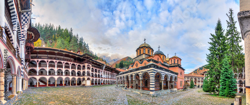 Beautiful panoramic panorama of the Orthodox Rila Monastery, a famous tourist attraction and cultural heritage monument in the Rila Nature Park mountains in Bulgaria photo