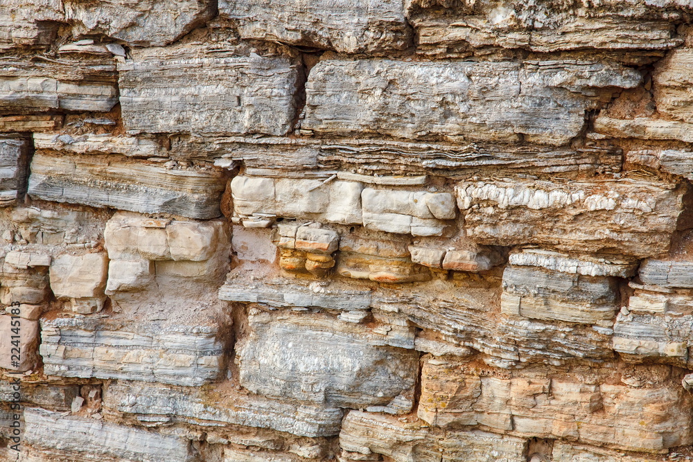 Close up of details of abstract natural stone rock cut texture cross section of weathered granite cliff erosion. Crack, hard. Close up of details of abstract natural stone rock cut texture cross section of weathered granite cliff erosion. Crack, hard.