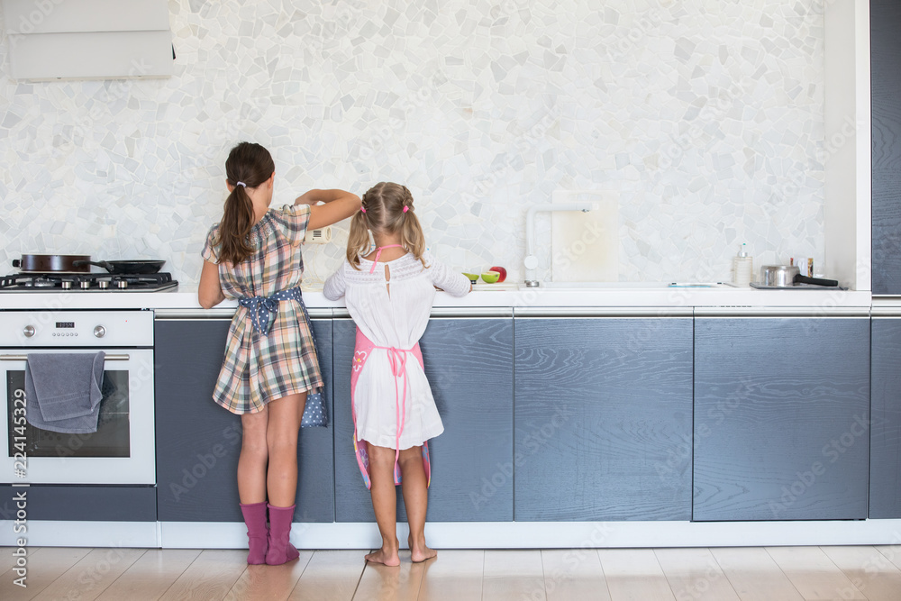 little girls cook in the kitchen little girls cook in the kitchen