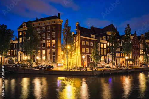 Amterdam canal, bridge and medieval houses in the evening