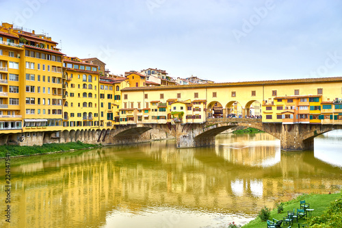 Famous bridge "Ponte Vecchio" at cloudy day in Florence in Italy