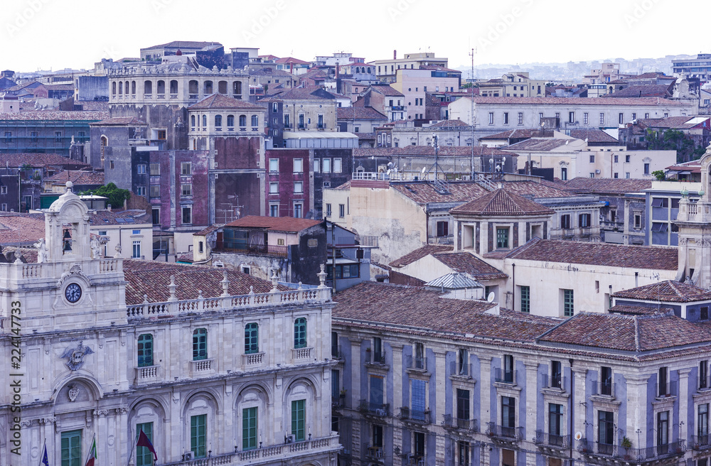 Catania rooftops and cityscape at sunrise in the background, Sicily, Italy