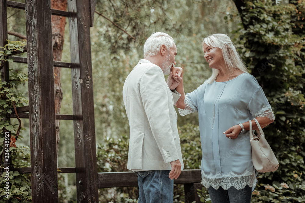 Naklejka premium Glad to see you. Cheerful blonde woman expressing positivity while meeting her old friend
