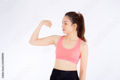 Beautiful portrait asian woman wear sport clothes have strong and muscle with health, girl show biceps with exercise and workout for wellness isolated on white background, strength and fit concept.
