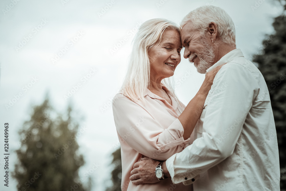 Enjoying silence. Pretty blonde keeping eyes closed while expressing her love Enjoying silence. Pretty blonde keeping eyes closed while expressing her love