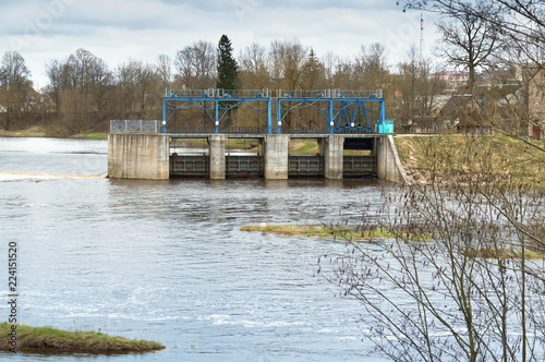 Hydraulic structure on the river. Hydroelectric power station and dam. The old hydroelectric power plant. photo