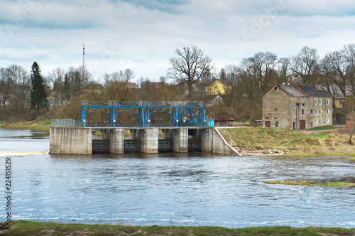 Hydraulic structure on the river. Hydroelectric power station and dam. The old hydroelectric power plant. photo