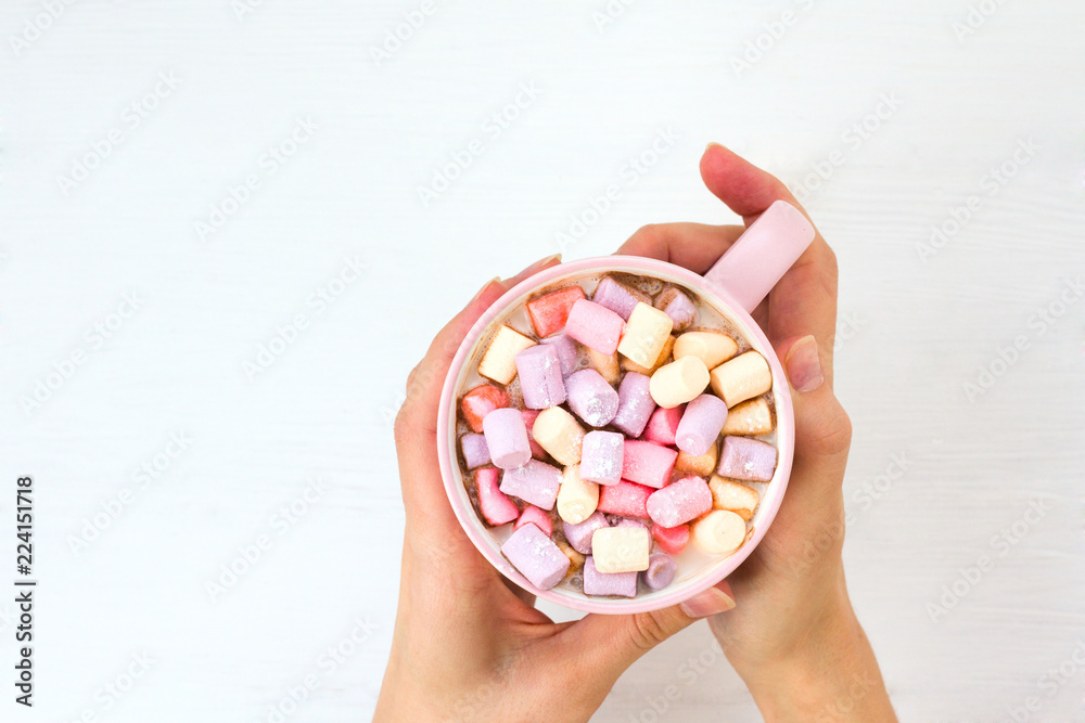 Christmas cocoa with marshmallow in a pink cup