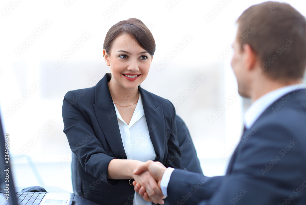 closeup of business woman shaking hands with her colleague. closeup of business woman shaking hands with her colleague.