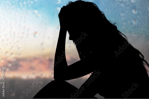Young woman crying on background