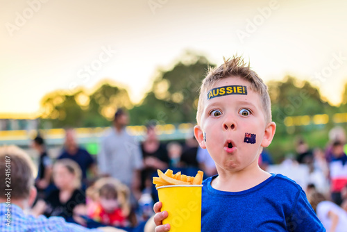 Canvas Print Cute Australian boy with flag tattoo on his face