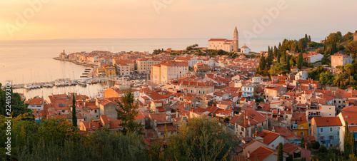 Beautiful aerial view on Piran town at the sunset, ancient buildings with red roofs and Adriatic sea in southwestern Slovenia