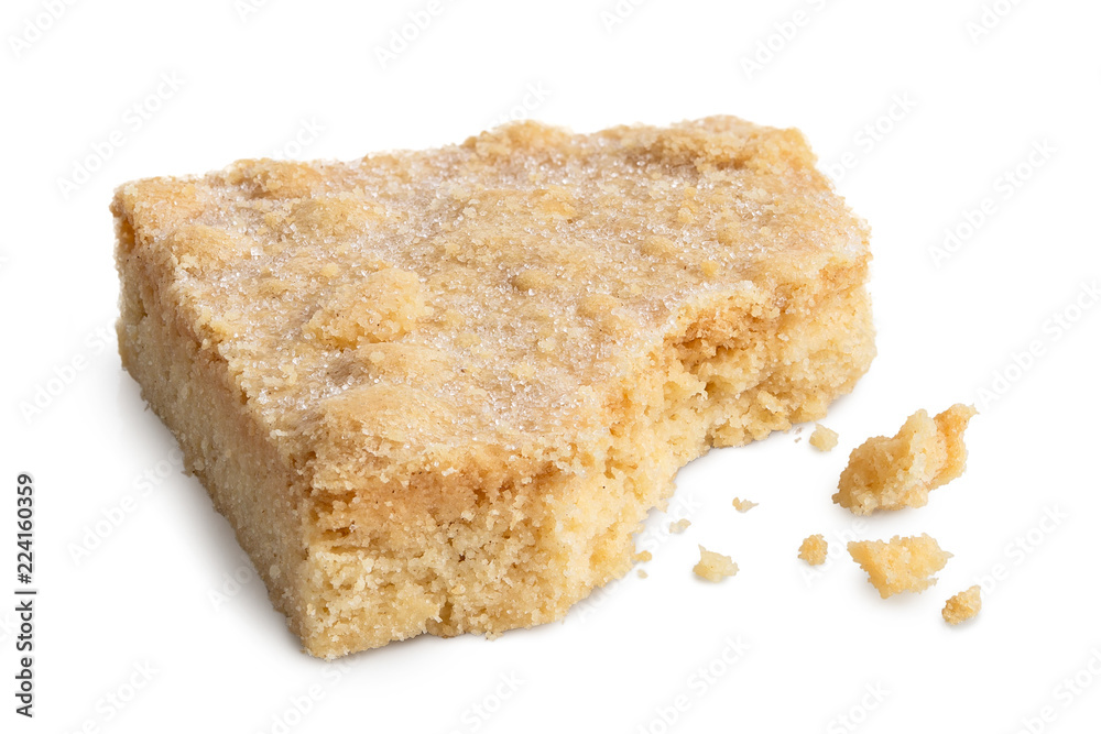 Classic homemade square shortbread biscuit isolated on white. Partially eaten. Classic homemade square shortbread biscuit isolated on white. Partially eaten.