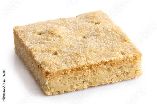 Classic homemade square shortbread biscuit isolated on white.