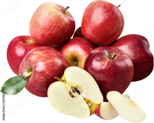 Pile of apples with one apple cut in half in front