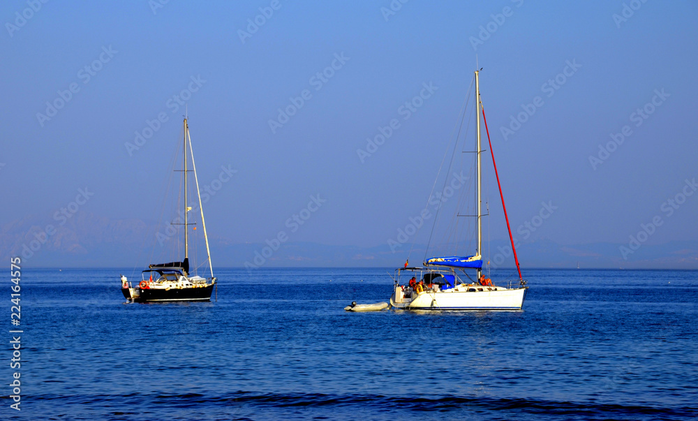 Obraz premium Sailboats in front of the beach of Zahara de los Atunes, Cadiz
