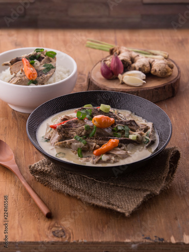 Delicious soup with fish and coconut milk. Indonesian culinary food, pindang with coconut milk. photo