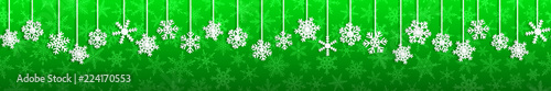 Christmas seamless banner with white hanging snowflakes with shadows on green background
