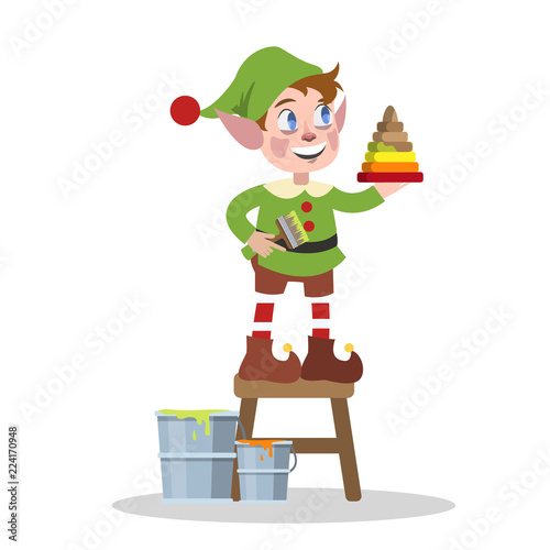 Cute christmas elf in green clothes making toy