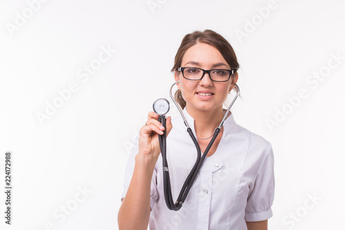 Smiling medical doctor woman with phonendoscope over white background with copy space
