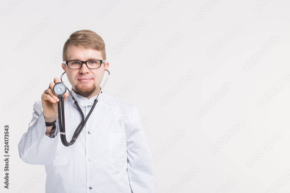Medical doctor man with stethoscope over white background with copy space Medical doctor man with stethoscope over white background with copy space