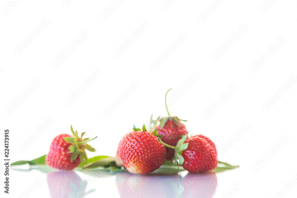 ripe red organic strawberry on a white