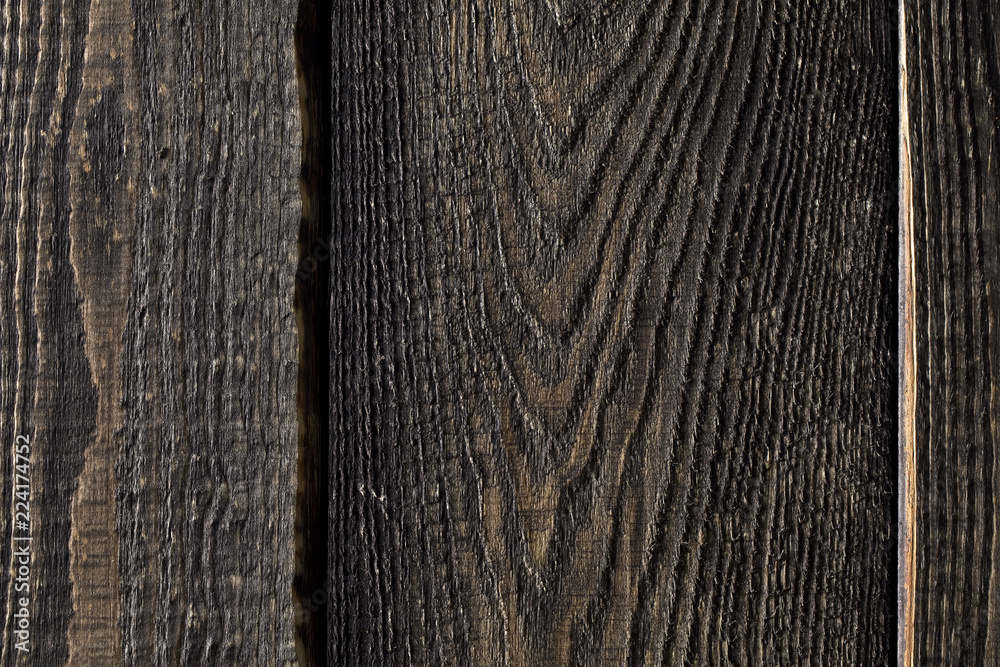 Fototapeta premium Close up of dark rustic wall made of old wood table planks texture. Rustic brown wood table texture background template for your design.
