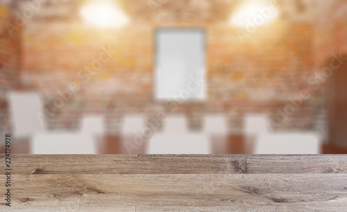 blank wooden table. Flooring. Brick wall. Open space office interior with like conference room. Mockup. 3D rendering.. Empty paintings