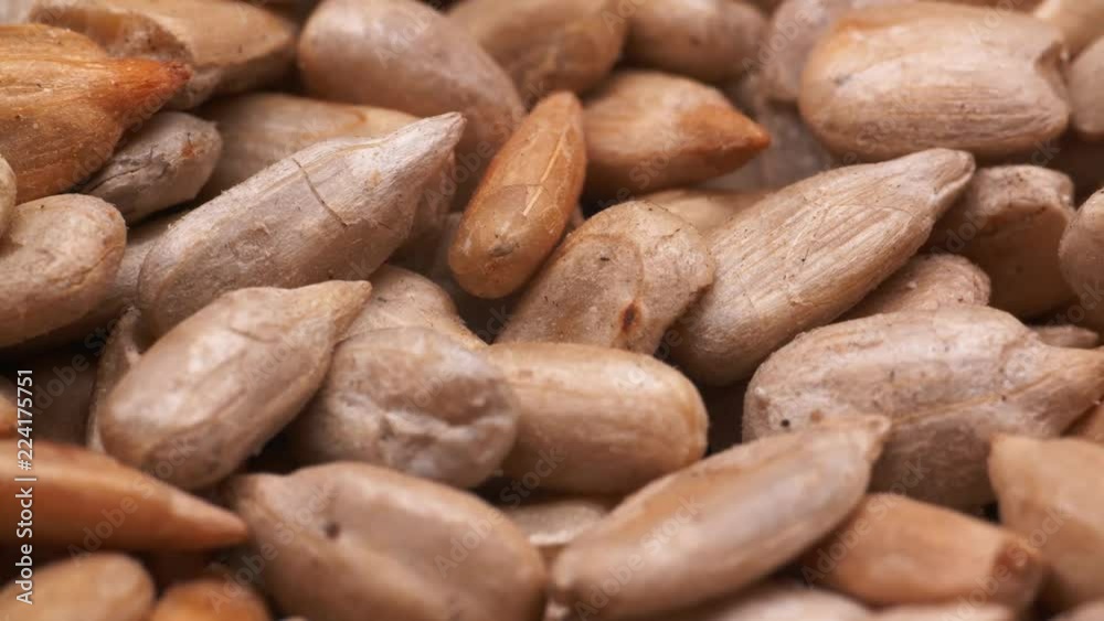 UHD macro of the peeled sunflower seeds on a turntable UHD macro of the peeled sunflower seeds on a turntable