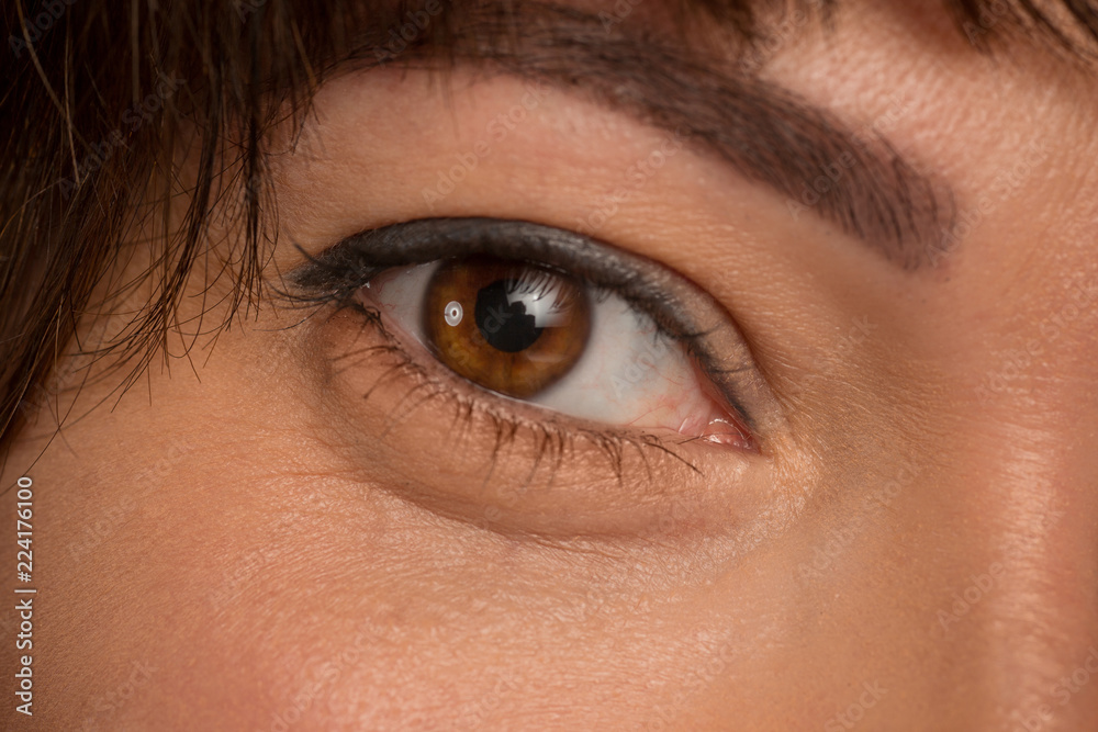 Fototapeta premium The close up Brown eyes on face of young beautiful caucasian girl
