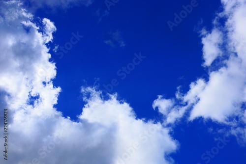 big white clouds in a bright blue sky