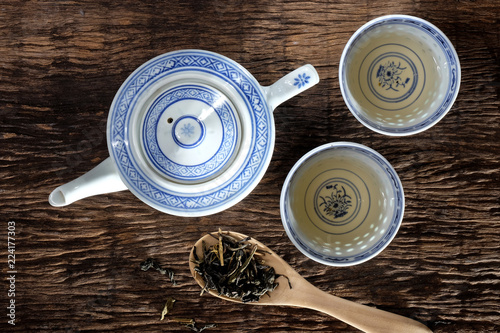Tea pot and dry tea leaf.