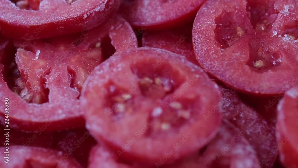 Frozen tomatoes. Frozen vegetables close up Frozen tomatoes. Frozen vegetables close up