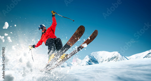 Skiing. Jumping skier. Extreme winter sports. photo